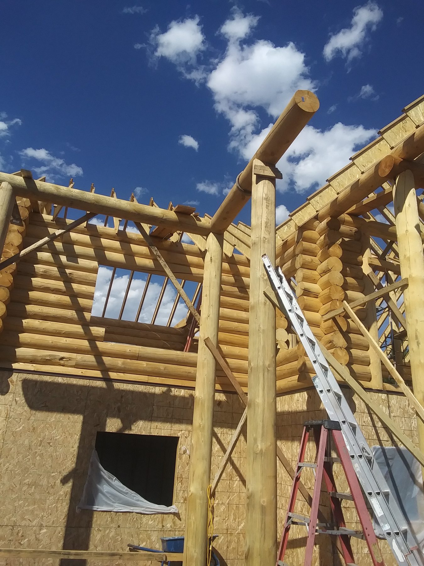 Roof timbers and purlins framed out above the second floor.