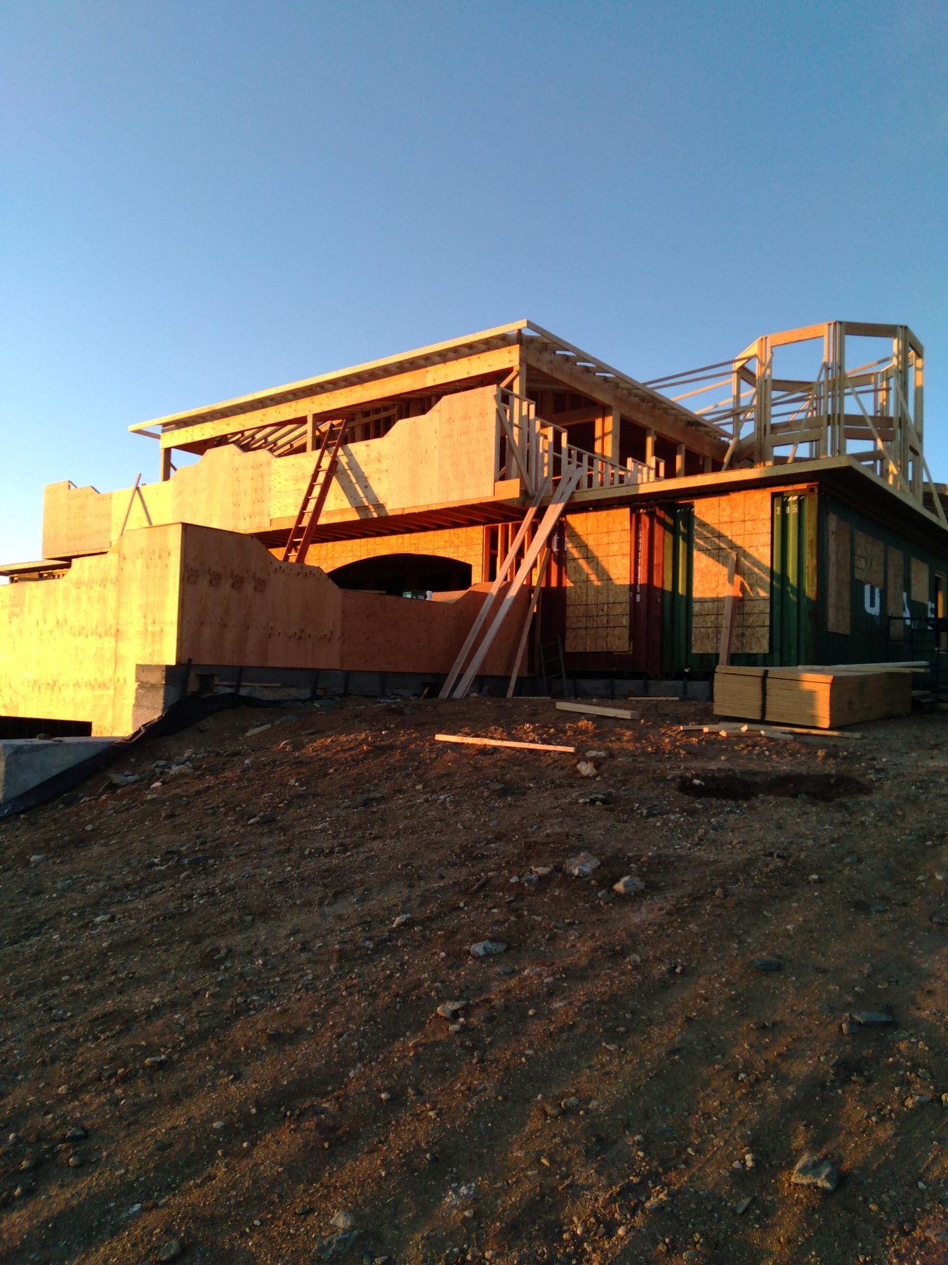 Framed openings and the timber deck frame in evening light.